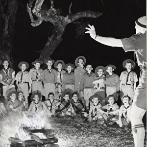Scouts singing round a campfire, Australia
