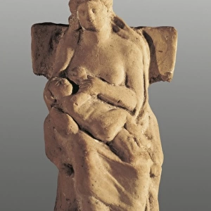 Seated Woman wirh Child. Clay figure. Greek art