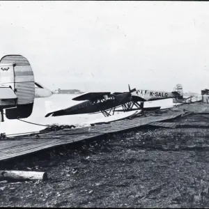 Print of DH.80A Puss Moth and Junkers F13 seaplane in flight Print of DH.80A Puss Moth and Junkers F13 seaplane in flight