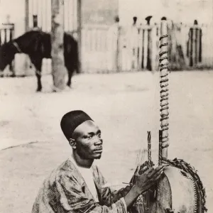 Senegal - Griot playing a Kora