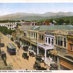 Shops, trams and vehicles on King Street, Kingston, Jamaica