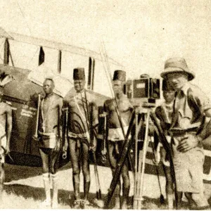 Shulluk warriors pose by Alan Cobhams aeroplane, Sudan