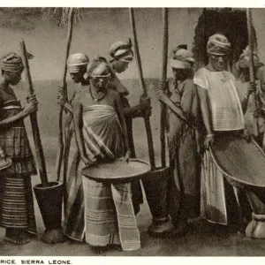 Sierra Leone, West Africa - Husking of Rice pestle & mortar