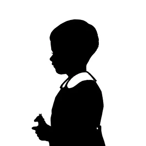 Silhouette of boy with toy horse