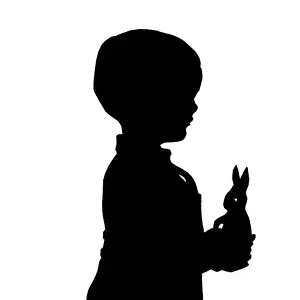 Silhouette of boy with toy rabbit