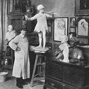 Sir George Frampton in studio with Peter Pan statue