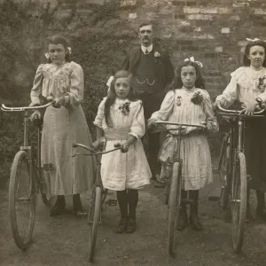 Four Sisters stand proudly with their bicycles