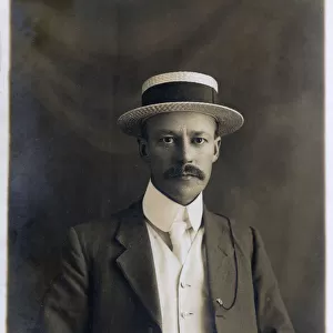 Smart and Handsome British Gentleman in straw boater hat