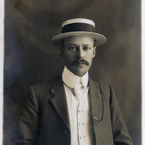 Smart and Handsome British Gentleman in straw boater hat