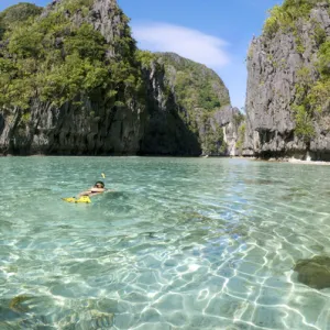 A snorkeller swims into an entry of a Big Lagoon