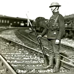 Soldier guarding line at Slough during railway strike