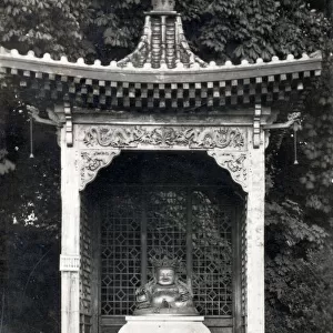 Statue of the Buddhist divinity Kuveraa in the grounds of Sandringham, Norfolk