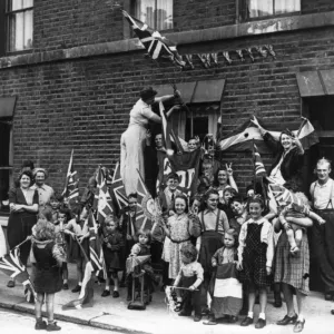 Street celebration with flags, VE Day