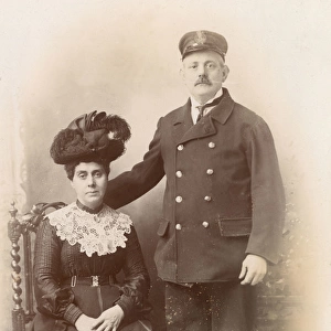 Studio portrait, Customs officer in uniform and wife