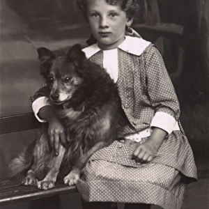 Studio portrait, little girl with a dog, Germany