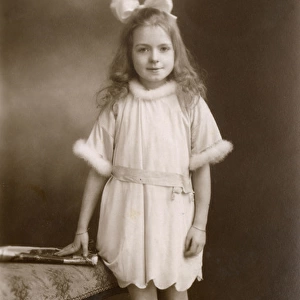 Studio portrait, little girl in party dress