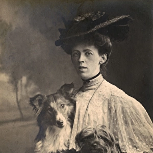Studio portrait, woman with two dogs
