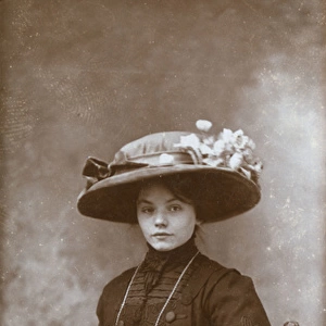Studio portrait, young Edwardian woman in a large hat