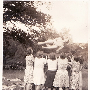 Summer Picnics tossing person in the air