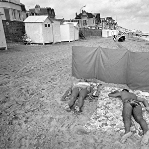 Sunbathers on the beach at Langrune Sur Mar, Normandy