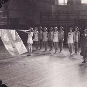 Swedish Gymnasts with flag in gym