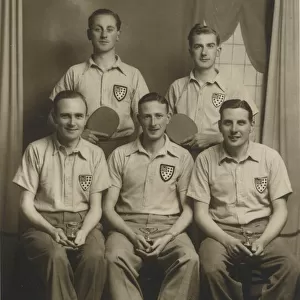 Five table tennis players, three posing with their trophies. Date: c. 1935