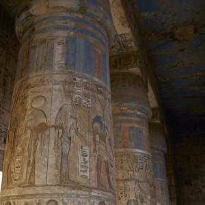 Temple of Ramses III. Columns decorated with polychromed rel