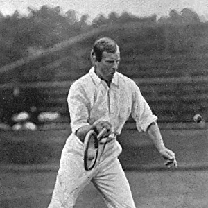 Tennis player Anthony Wilding serving, 1905