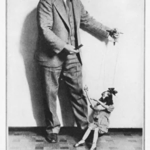 Tony Sarg and one of his dancing marionettes, 1928