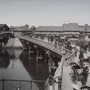 Traffic and pedestrians on the Daikoku bridge, Osaka, Japan