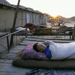 Turmen - a family sleeps outside on plank-beds - sunrise