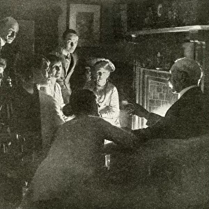 Typical English family gathered around the fireside