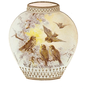 Vase decorated with birds on a cutout Christmas card