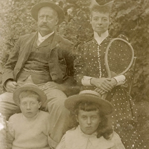 Victorian family group with tennis racquet