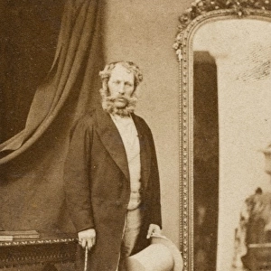 Victorian man standing by a mirror