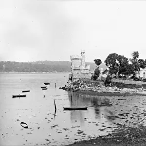 A side view of a Castle by the sea that appears to be Blackr