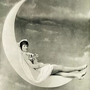 Violet Friend, reclining on a crescent moon