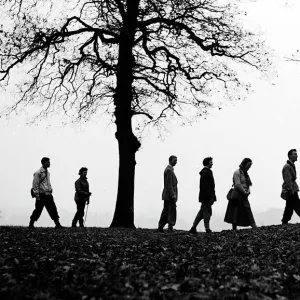 Walkers on the brow of a hill making a silhouette