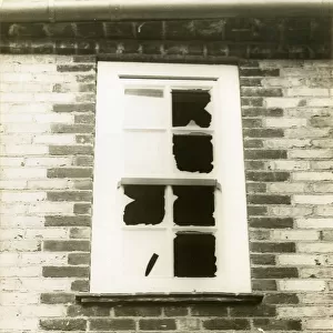 Window broken by suffragettes
