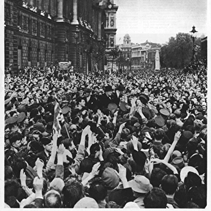 Winston Churchill surrounded by V-E Day crowds