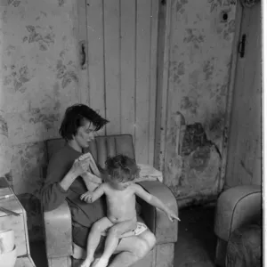 Woman bathing baby, Falls Road, Northern Ireland