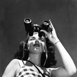 WOMAN WITH BINOCULARS