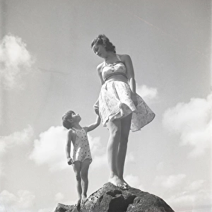 Woman and child on a rock