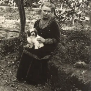 Woman with a dog in a garden, Italy