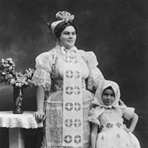 Woman and girl in East European folk costume