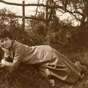 Woman lying on grass in a field