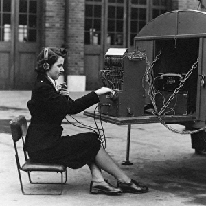 Woman operating field telephone van, WW2