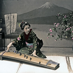 Woman playing a Koto, Japan