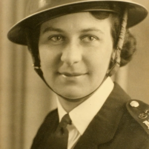Woman police officer in air raid helmet, London, WW2