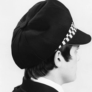 Woman police officer in updated hat, London
